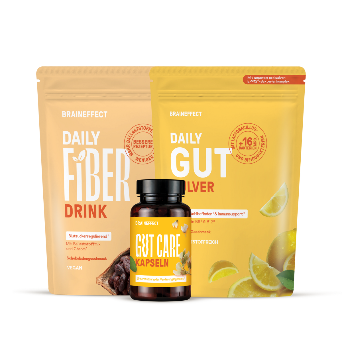 Zwei BRAINEFFECT Beutel "DAILY FIBER DRINK" und "DAILY GUT" sowie eine Dose "GUT CARE KAPSELN" vor schwarzem Hintergrund.