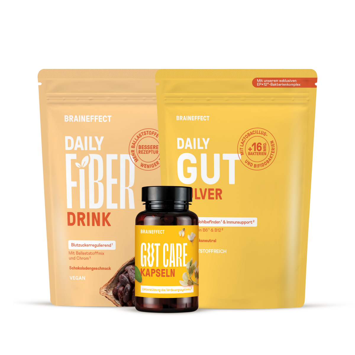 Zwei Nachfüllbeutel und eine Dose BRAINEFFECT-Produkte mit den Aufschriften "BRAINEFFECT DAILY FIBER DRINK", "BRAINEFFECT DAILY GUT PULVER" und "BRAINEFFECT GUT CARE KAPSELN" auf schwarzem Hintergrund.