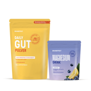 Two BRAINEFFECT pouches against a black background, on the left the yellow pouch "BRAINEFFECT DAILY GUT PULVER" with labels "Mit unserem exklusiven EP×12®-Bakterienkomplex" and "+16 MRD. BACTERIEN UND BIFIDOBAKTERIEN"