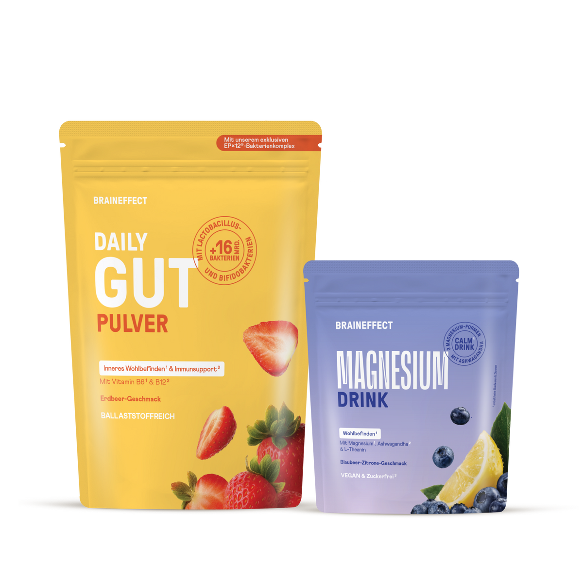 Two BRAINEFFECT pouches on a black background: left is yellow "DAILY GUT PULVER" with strawberries and "Mit unserem exklusiven EPX12-Bakterienkomplex", right is purple "MAGNESIUM DRINK" with blueberries and lemon.