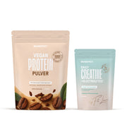 Two BRAINEFFECT pouches with coffee beans, featuring the labels "BRAINEFFECT VEGAN PROTEIN PULVER MIT ENZYMEN AUS ANANAS UND PAPAYA HIGH PROTEIN Unterstützg. der Verdaungsenzyme Mit Calcium sowie Bromelain und Papain Kaffee Geschmack VEGAN"