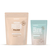 Two BRAINEFFECT pouches of "VEGAN PROTEIN PULVER" in beige and "DAILY CREATINE + ELECTROLYTES" in light blue against a white background.